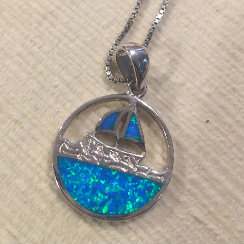 Beautiful silver necklace with Opal chips sailboat medallion